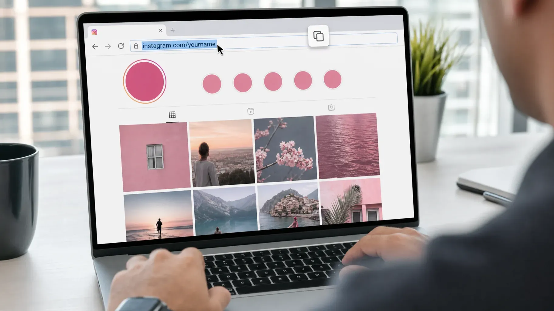 Person on a laptop with an Instagram profile open and the address bar instagram.com/yourname selected to copy the URL